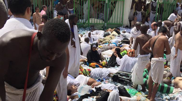 Muslim pilgrims gather around the victims of a stampede in Mina, Saudi Arabia during the annual hajj pilgrimage on Thursday, Sept. 24, 2015. Hundreds were killed and injured, Saudi authorities said. The crush happened in Mina, a large valley about five kilometers (three miles) from the holy city of Mecca that has been the site of hajj stampedes in years past. (AP Photo)